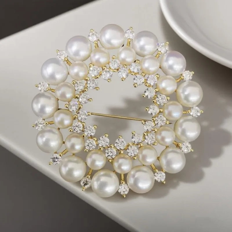 https://ae01.alicdn.com/kf/Sd6fa2ead55ec421f93bc5b944ba227086/Exquisite-Round-Wreath-Brooch-High-end-Women-s-Luxury-Temperament-Pearl-Corsage-Pin-Suit-Accessory-Collar.jpg