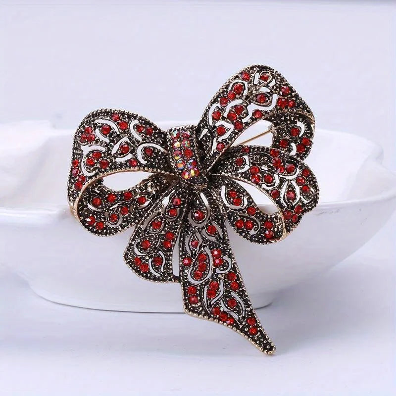 https://ae-pic-a1.aliexpress-media.com/kf/S25e045b288c74881b7d74d36761cdad7U/Luxury-Crystal-Bow-Ribbon-Brooches-For-Women-Men-Fashion-Bowknot-Pins-Jewelry.jpg