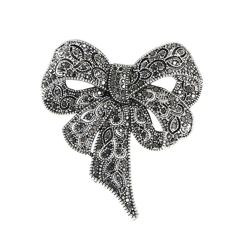 https://ae-pic-a1.aliexpress-media.com/kf/Sa4694bd7621441f4906fad2c4d01bd9aj/Luxury-Crystal-Bow-Ribbon-Brooches-For-Women-Men-Fashion-Bowknot-Pins-Jewelry.jpg
