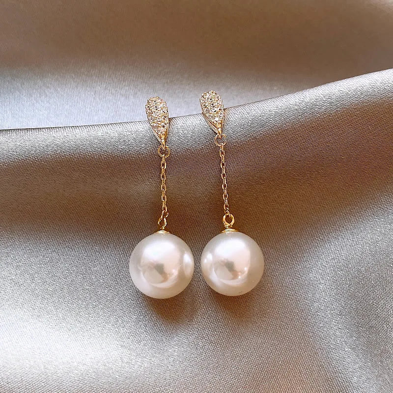 Luz de luxo high-end pequena borla brincos de pérola 2024 novas jóias rosto redondo adequado acessórios de orelha para mulheres e meninas presente